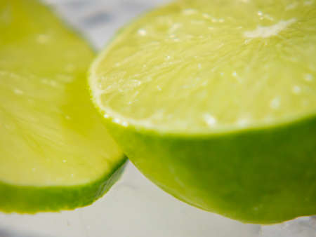 Frozen lime with ice in summer and start melting.の写真素材