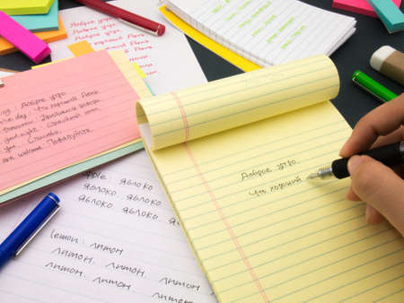 Writing new words again and again to learn new language.の写真素材