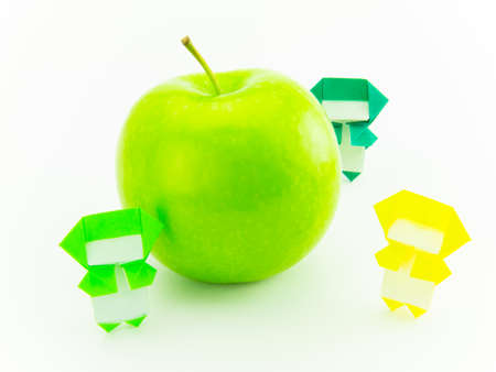 Colorful origami Ninja playing with the vegetables and fruits.の写真素材