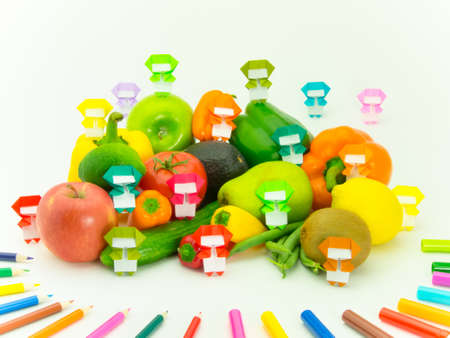 Colorful origami Ninja playing with the vegetables and fruits.の写真素材