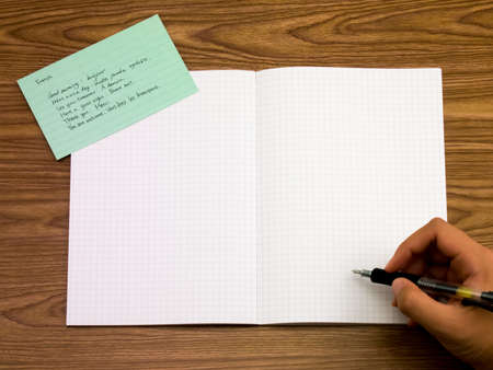 French; Learning New Language Writing Words on the Notebook