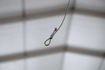 Cables and hook hanging from the Ceiling at the Construction siteの写真素材