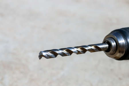 The Isolated Drill Bits with the Gray Ground Backgroundの写真素材