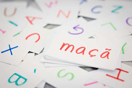 Portuguese; Learning the New Word with the Alphabet Cards (Translation; Apple)の写真素材