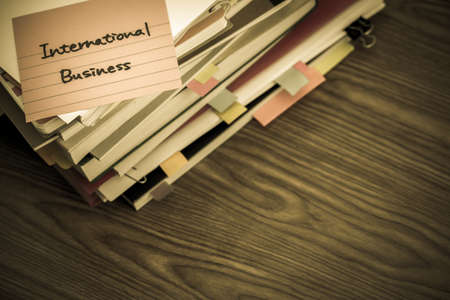 International Business; The Pile of Business Documents on the Deskの写真素材