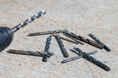 The Isolated Drill Bits with the Gray Ground Backgroundの写真素材