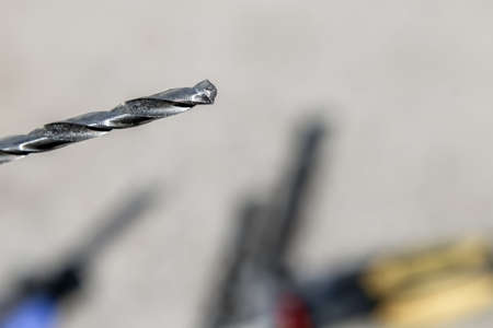 The Isolated Drill Bits with the Gray Ground Backgroundの写真素材