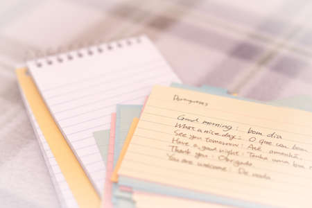 Portuguese; Learning New Language Writing Greetings on the Notebookの写真素材