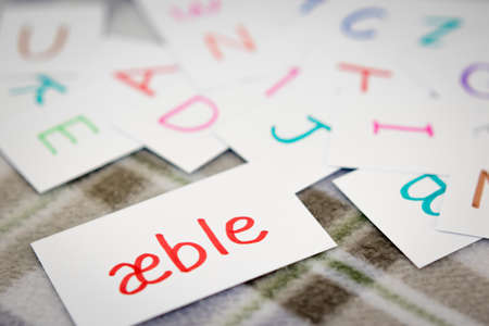 Danish; Learning the New Word with the Alphabet Cards (Translation; Apple)の写真素材