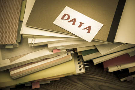 Data; The Pile of Business Documents on the Deskの写真素材