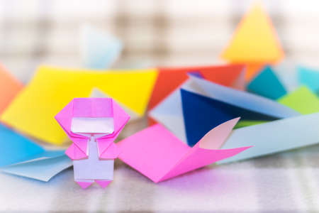 The Little Ninja Kid are Teaching How to Play Origamiの写真素材