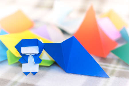 The Little Ninja Kid are Teaching How to Play Origamiの写真素材