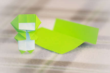 The Little Ninja Kid are Teaching How to Play Origamiの写真素材