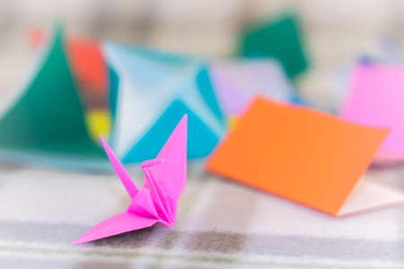 Teaching How to Make Crane from Small Piece of Origamiの写真素材