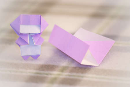 The Little Ninja Kid are Teaching How to Play Origamiの写真素材