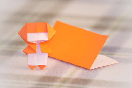The Little Ninja Kid are Teaching How to Play Origamiの写真素材