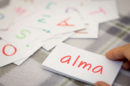 Hungarian; Learning the New Word with the Alphabet Cards (Translation; Apple)の写真素材