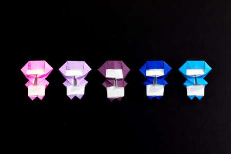 The Handmade Origami Ninja Kids on the Black Backgroundの写真素材