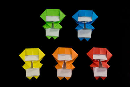 The Handmade Origami Ninja Kids on the Black Backgroundの写真素材