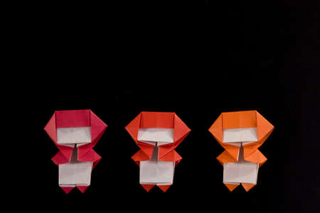 The Handmade Origami Ninja Kids on the Black Backgroundの写真素材