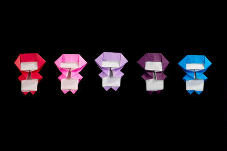 The Handmade Origami Ninja Kids on the Black Backgroundの写真素材