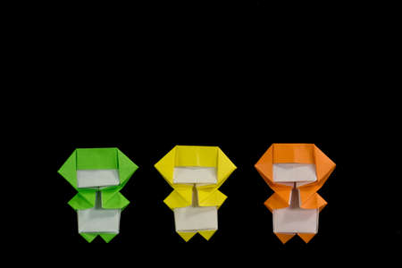 The Handmade Origami Ninja Kids on the Black Backgroundの写真素材