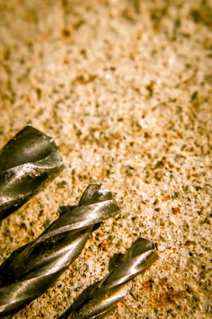 The Isolated Drill Bits with the Gray Ground Backgroundの写真素材