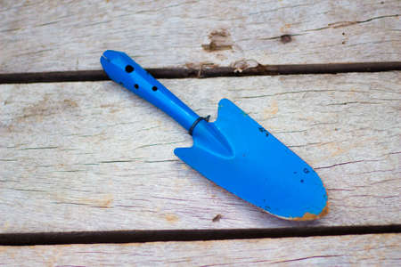 shovel diging in clay potの写真素材