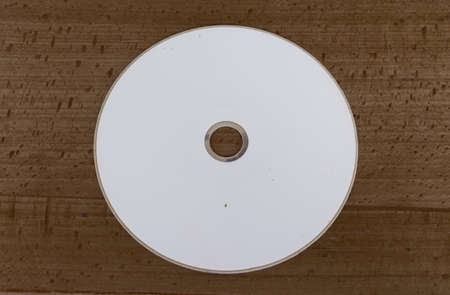 CD with wood backgroundの写真素材