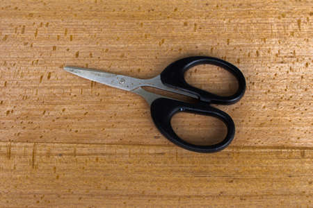 scissors with wood backgroundの写真素材