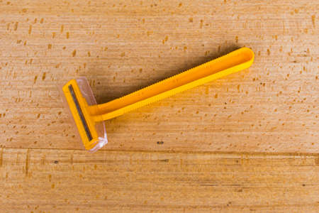 Shaving with wood backgroundの写真素材