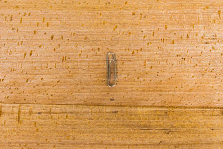 paperclip with wood backgroundの写真素材