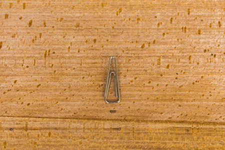 paperclip with wood backgroundの写真素材