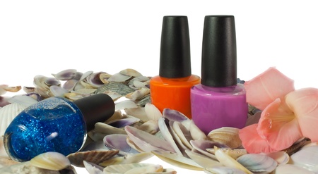 Three nails polish and seashells isolated on white backgroundの写真素材