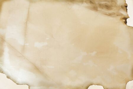 old handmade paper sheet with burned edges, texture, backgroundの写真素材
