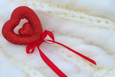 red heart - Valentine with ribbon on fluffy soft white backgroundの写真素材