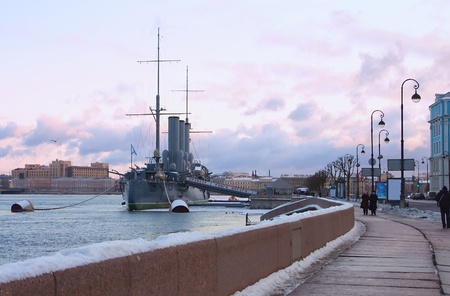 Legendary cruiser Aurora ( Warship museum) and Neva embankment in winter day. St. Petersburg, Russiaのeditorial素材