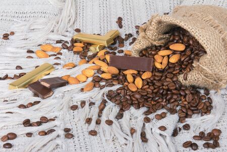 chocolates, Coffee beans and almonds in bagの写真素材