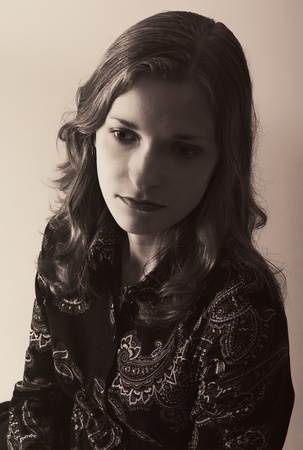 Dramatic portrait of a very sad girl in retro style
