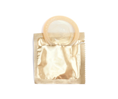 Yellow condom with open pack, isolated on white backgroundの写真素材
