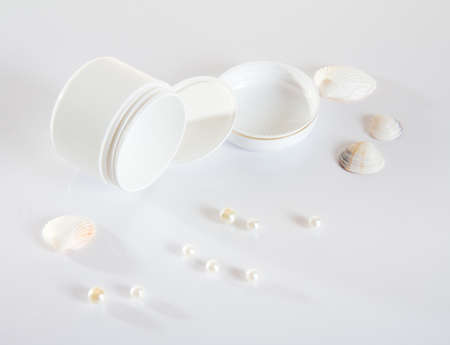 White empty cream jar on white background, top view