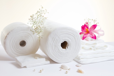 Spa accessories: white sheets and towels on white backgroundの写真素材