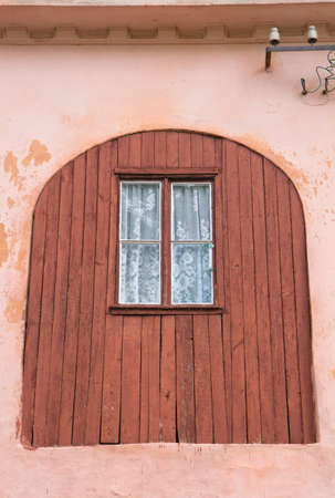 Building Facade: old brown wooden window close upの写真素材