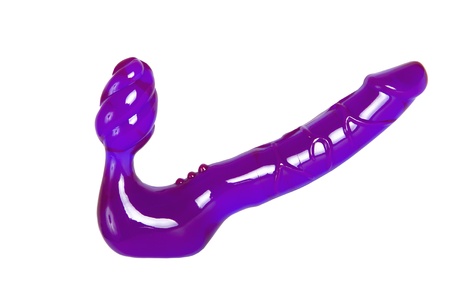 Sex toy - purple strapon for role play games isolated on whiteの写真素材