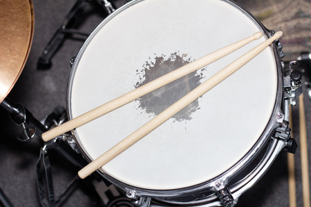Closeup image of a drum with drum sticksの写真素材
