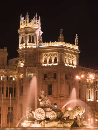 Plaza de Cibeles in Madrid, Spain at night.  With Cibeles Fountain and the Royal Mail office in the background (Palacio de Comunicaciones or Correos).の写真素材