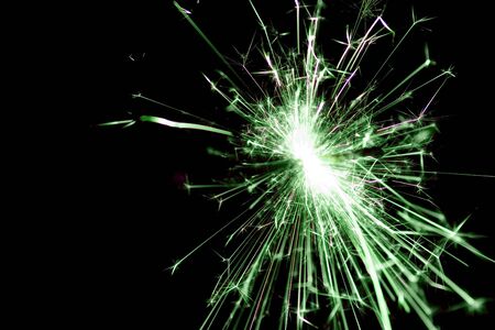 Green sparkler used for celebrationsの写真素材