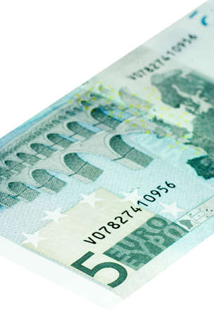 Five Euro bill isolated on a white background with focus on the 5.