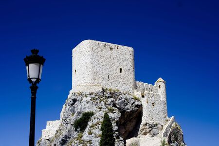Olvera is a white village (pueblo blanco) in Cadiz province, Andalucia, Spain.  It features a moorish fortress and a neoclassic cathedral overlooking the whitewashed village.の写真素材