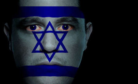 Israeli flag painted/projected onto a man's face.の写真素材